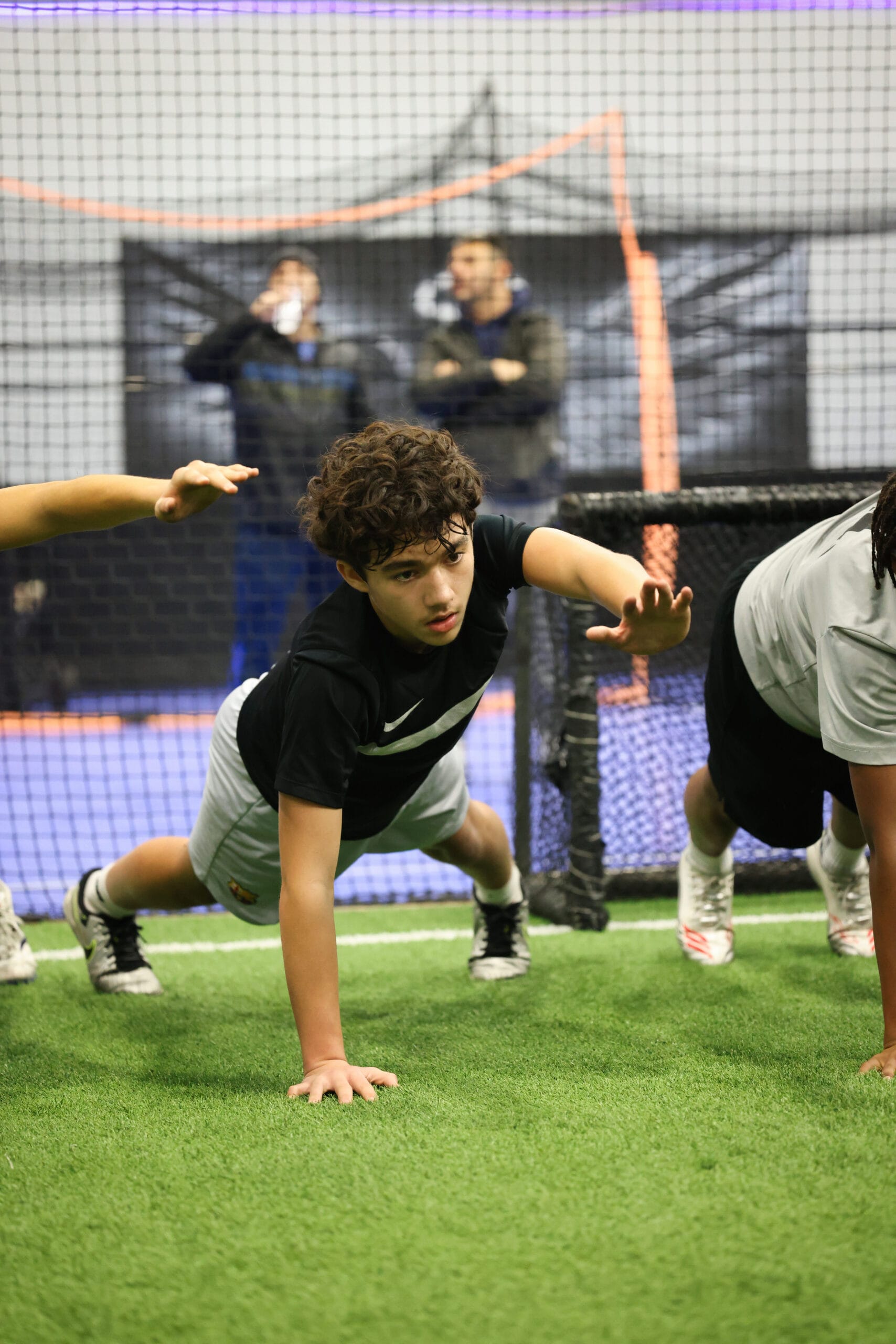 5K2A0525 Youth soccer player working on strength, balance, and body control during indoor training session