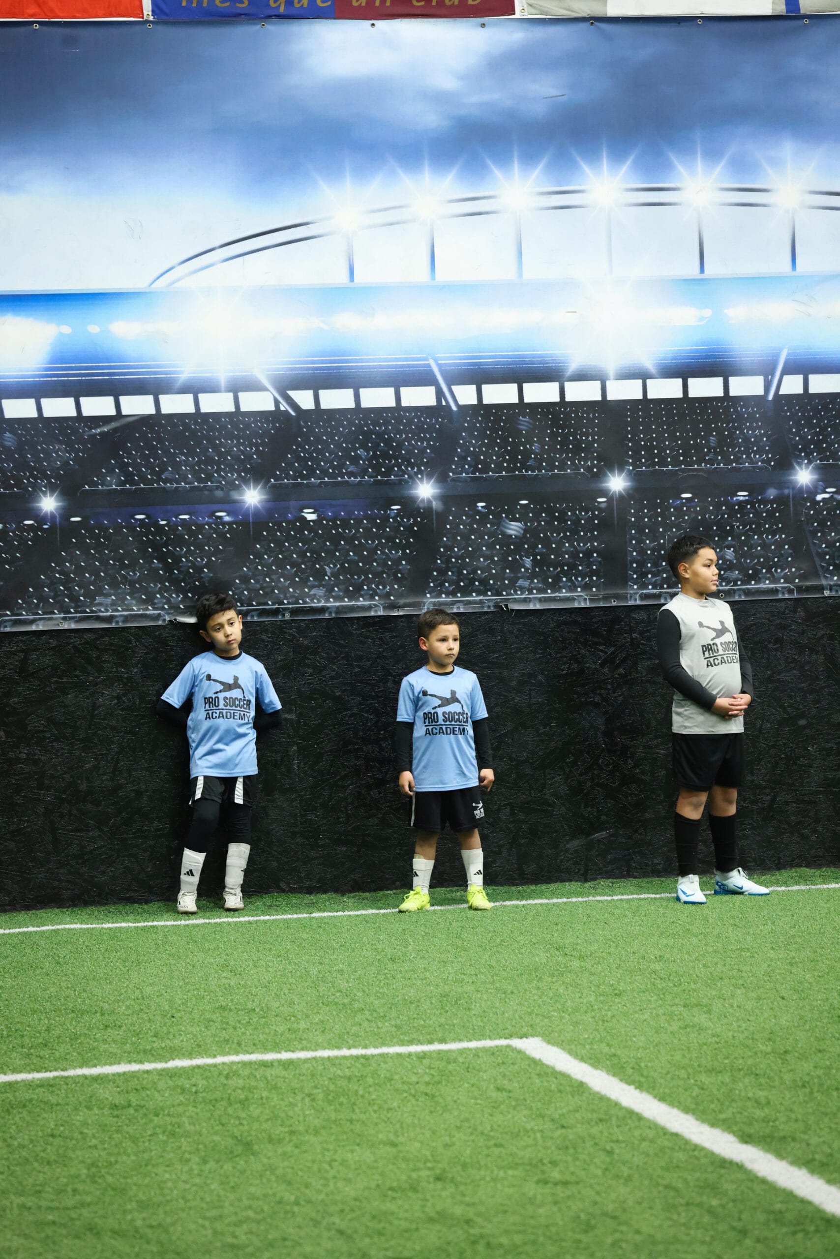 5K2A8672 Young soccer players lined up and listening during an indoor youth soccer training session in New Jersey