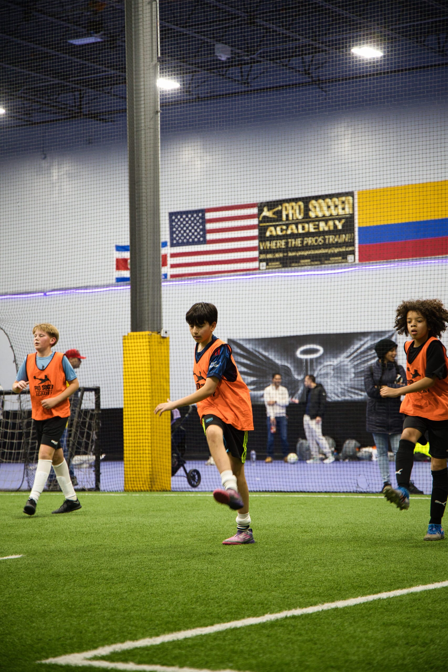 4Q8A0109 Youth soccer players stretching and preparing for drills at Pro Soccer Academy