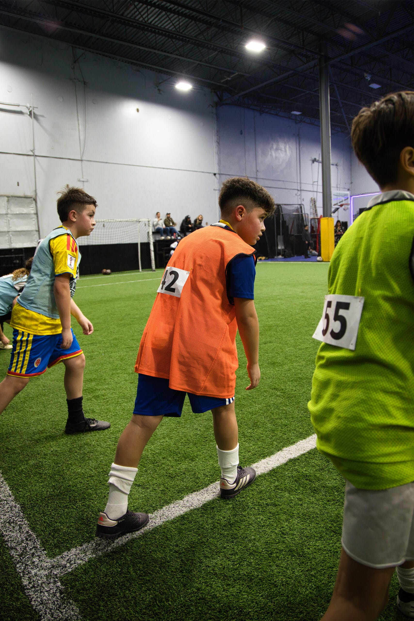 4Q8A0120 Pro Soccer Academy coaching staff reviewing player evaluations during indoor tryouts