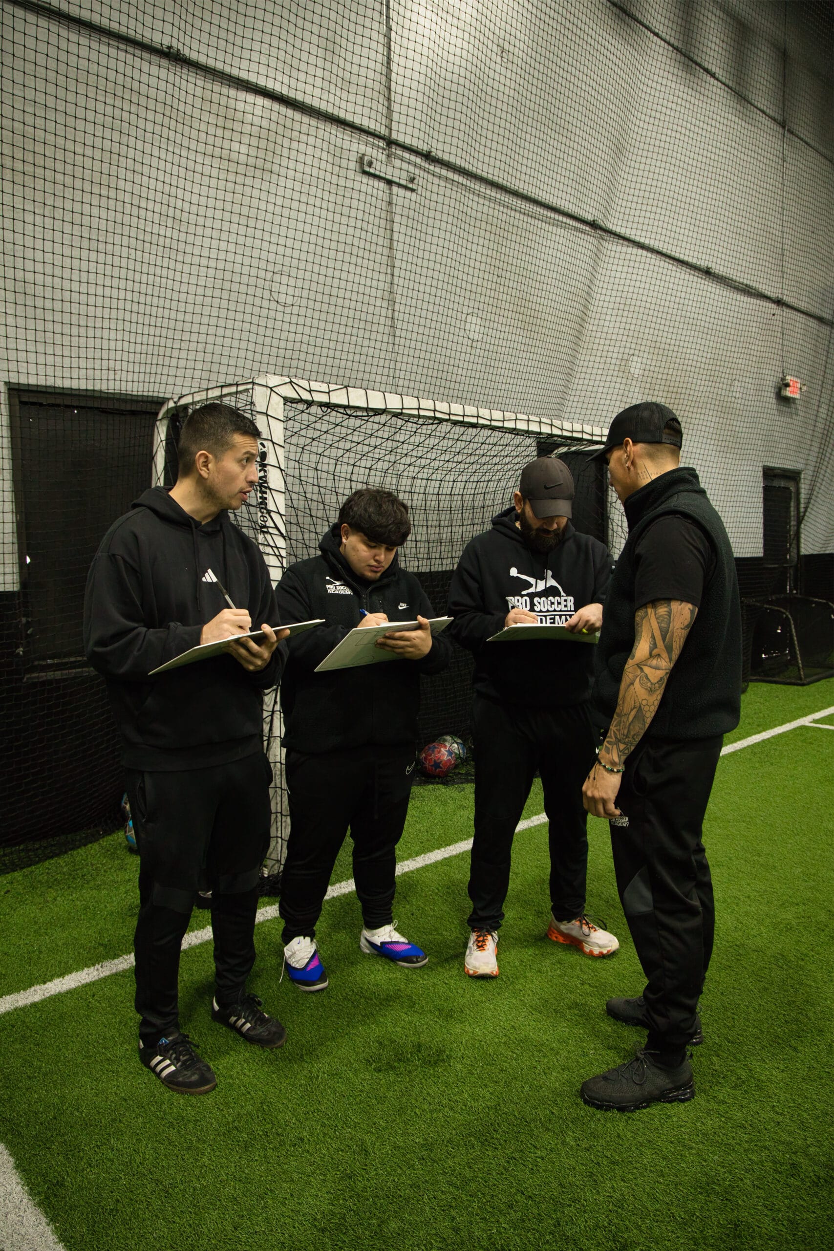 4Q8A0130 Pro Soccer Academy coach taking notes during youth soccer evaluations