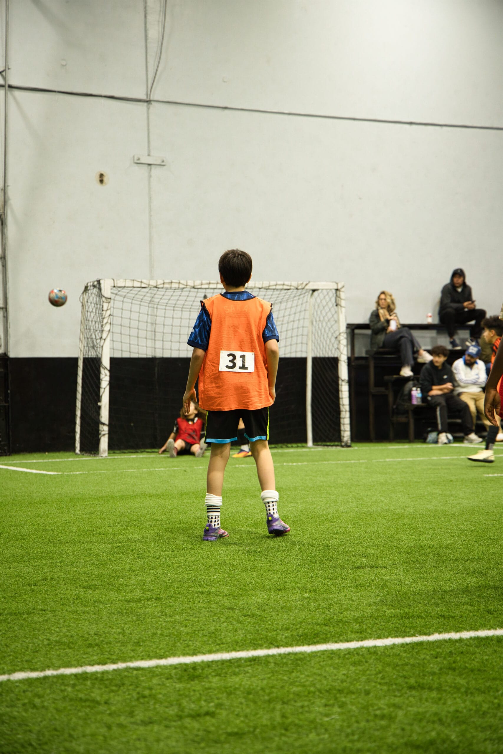 4Q8A0156 Young soccer player wearing number 31 during Pro Soccer Academy indoor game
