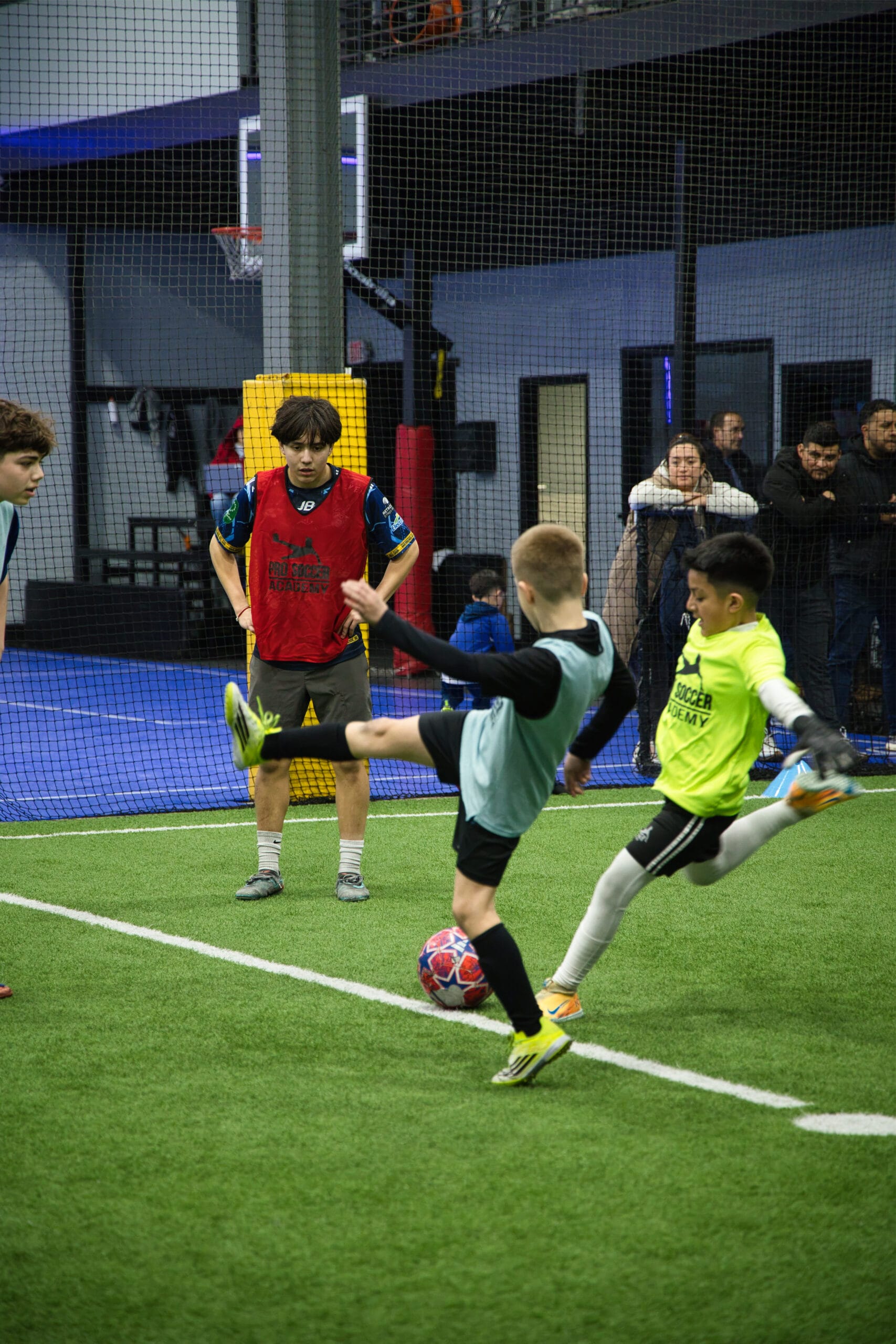 4Q8A0312 Youth soccer players competing for the ball during a small-sided training game at Pro Soccer Academy.