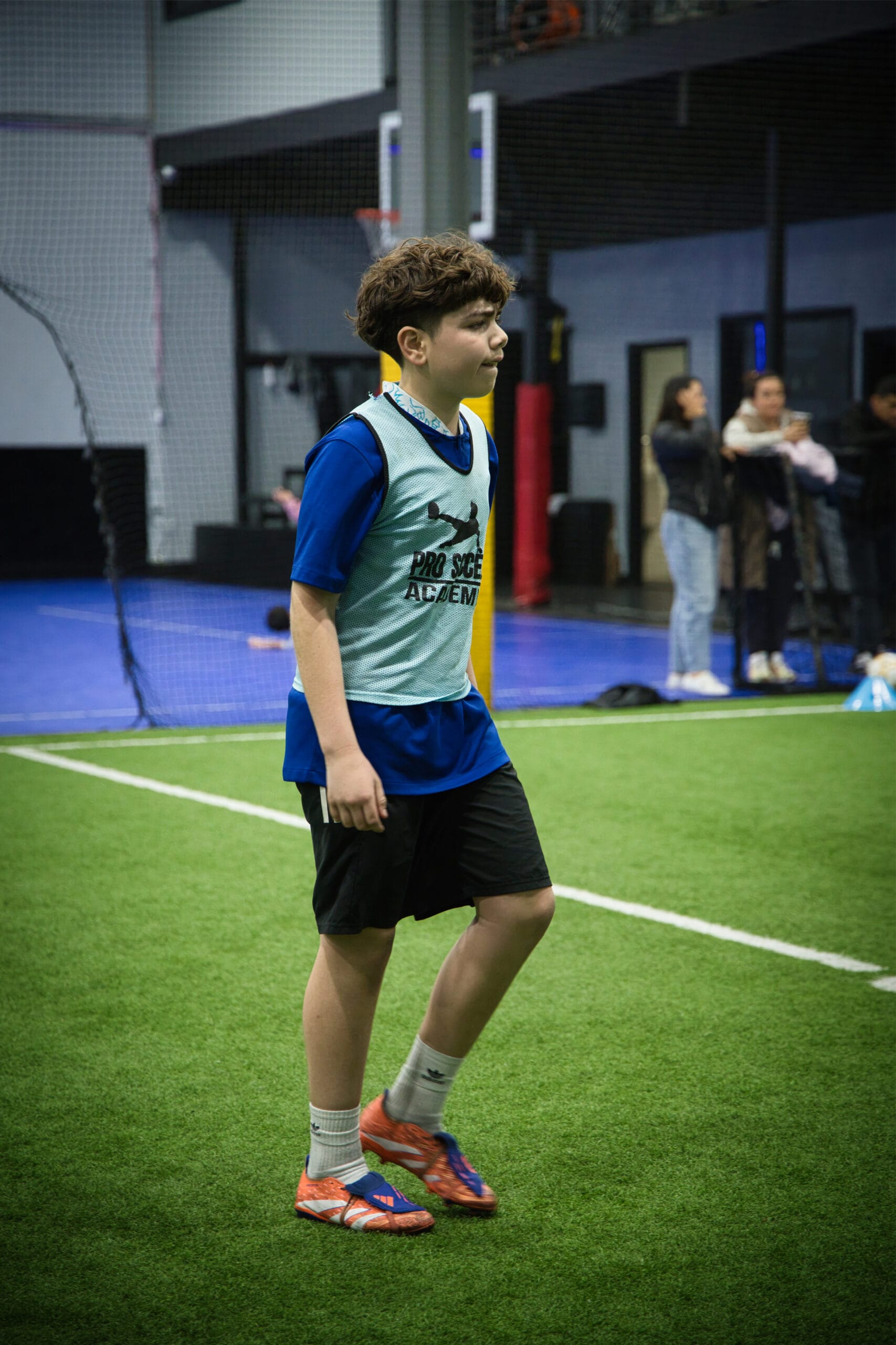 4Q8A0349 Focused youth soccer player standing during training at Pro Soccer Academy.