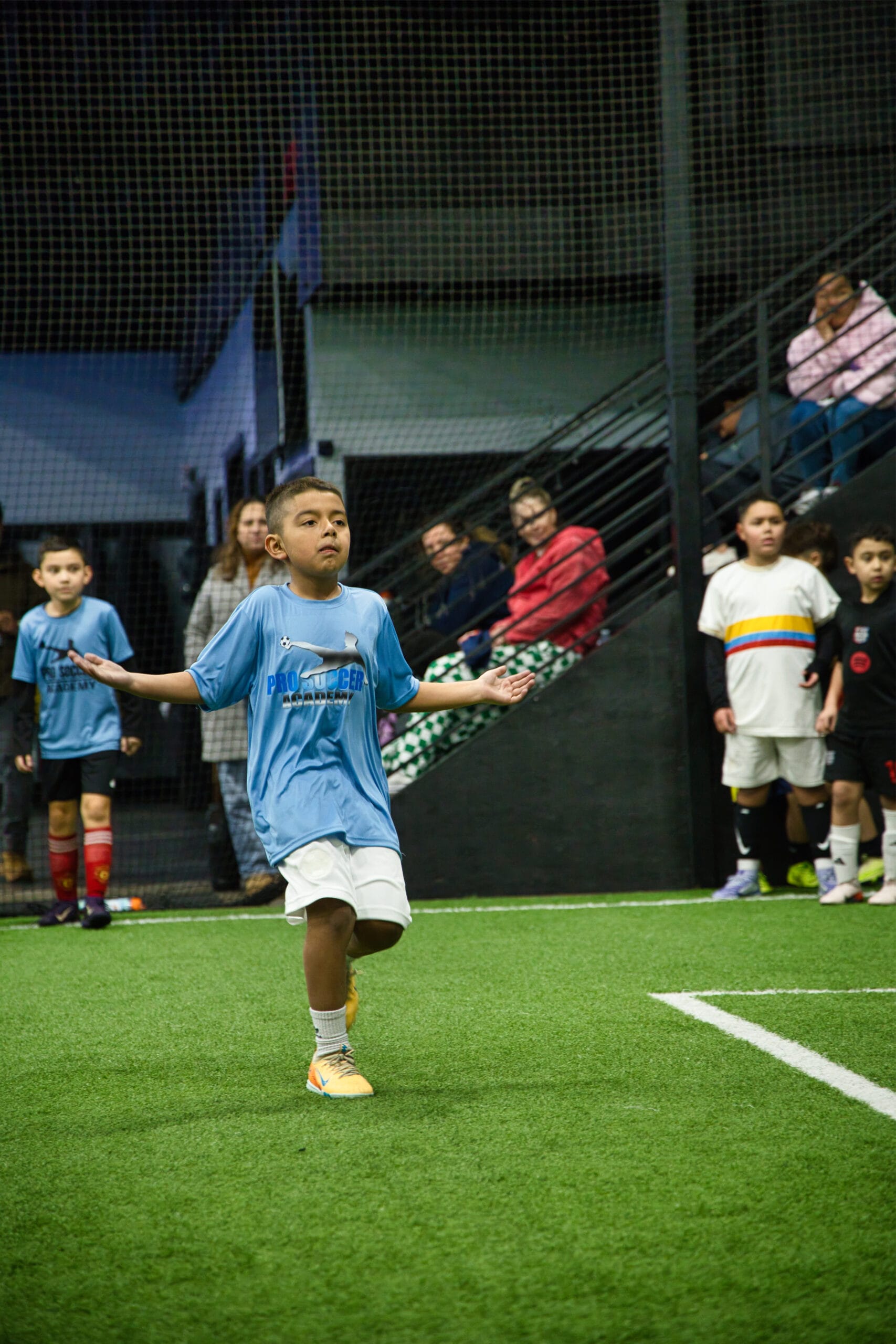 4Q8A0353 Youth soccer player reacting during a training match at Pro Soccer Academy.