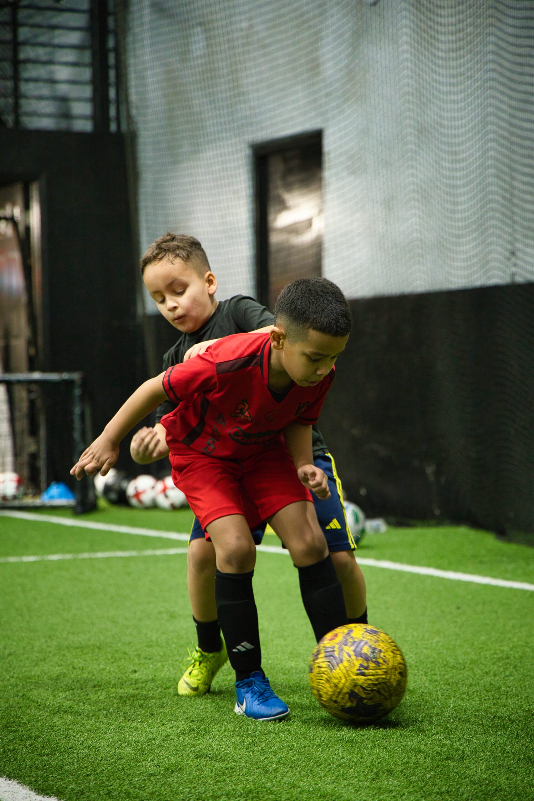 4Q8A0393 Youth soccer players battling for control of the ball during Pro Soccer Academy training.