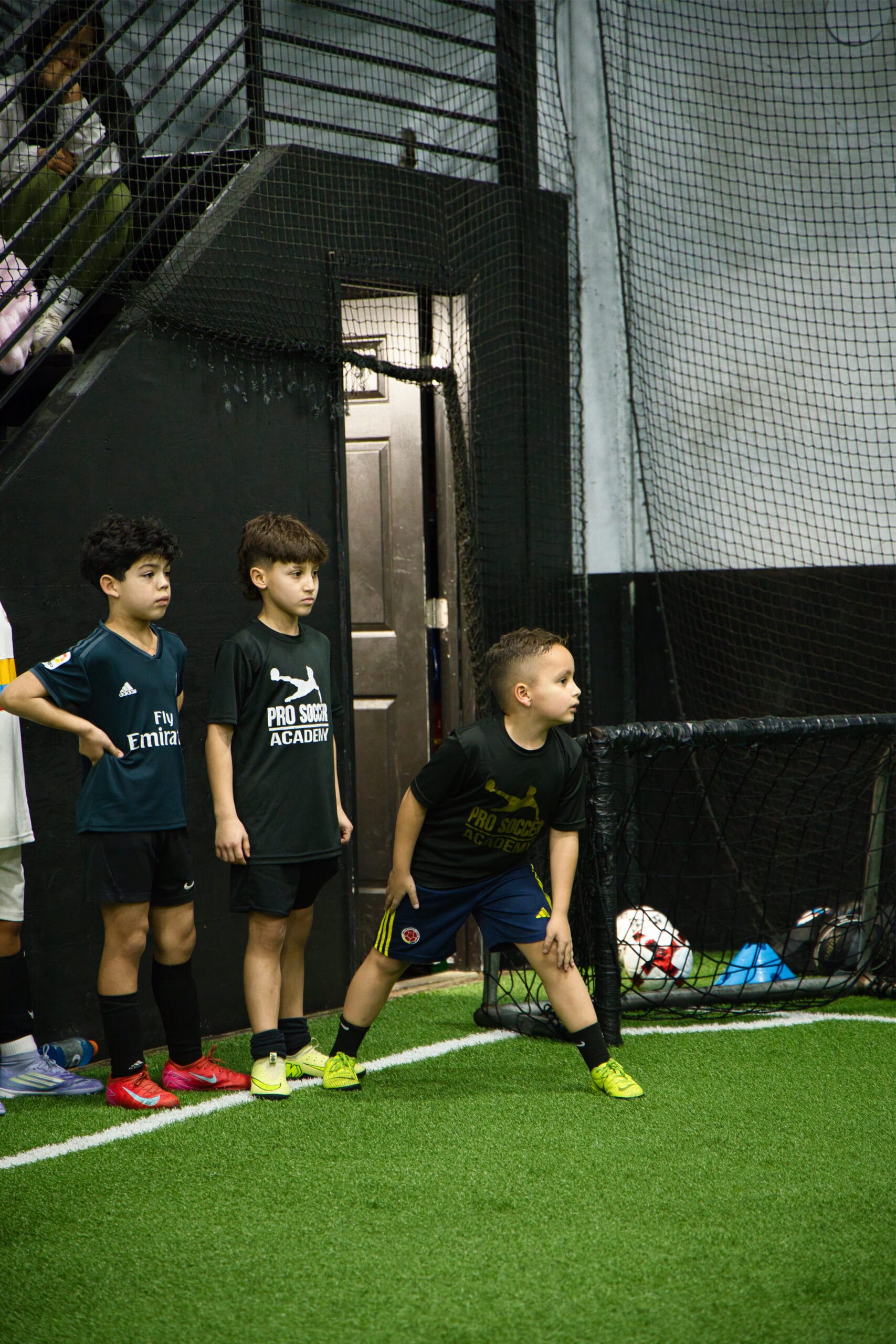 4Q8A0406 Youth soccer players lined up and listening during a Pro Soccer Academy training session.